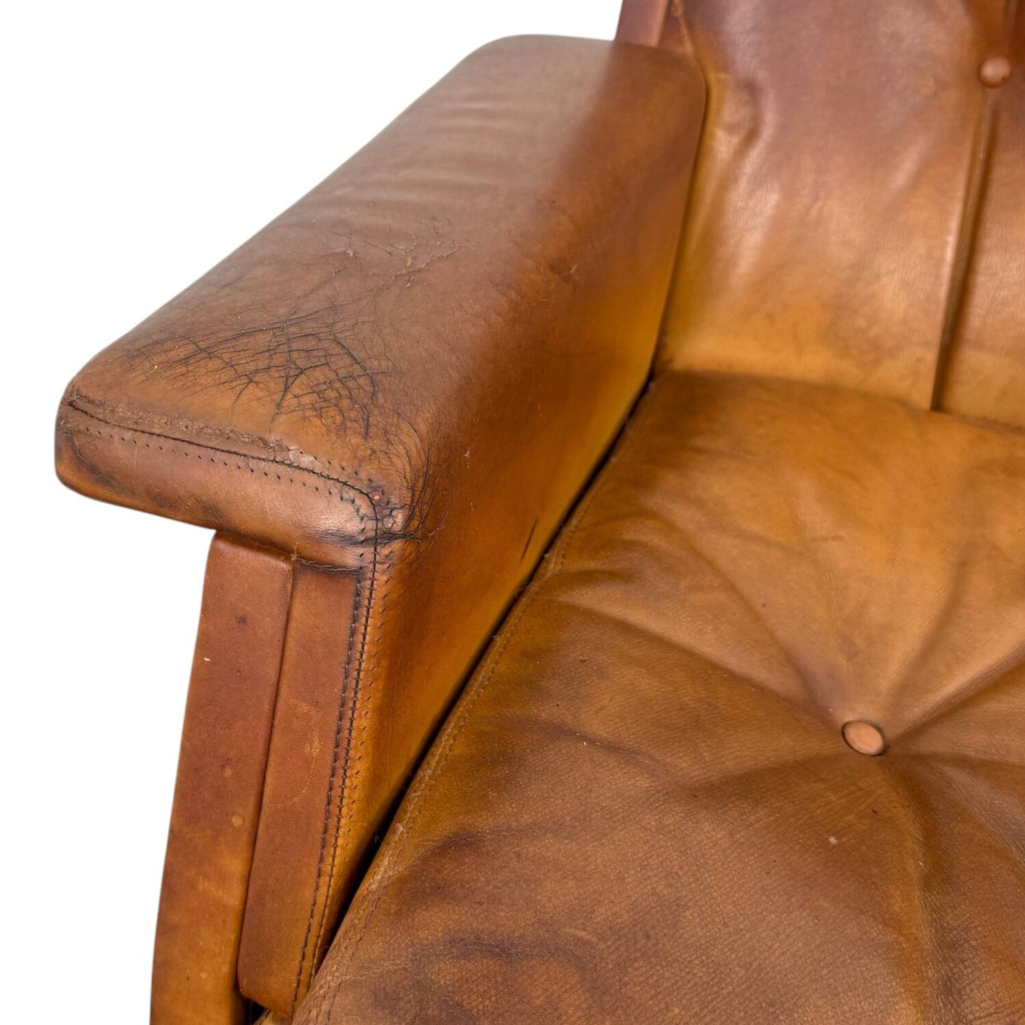 Pair of vintage cognac leather swivel lounge chairs by Eugen Schmidt