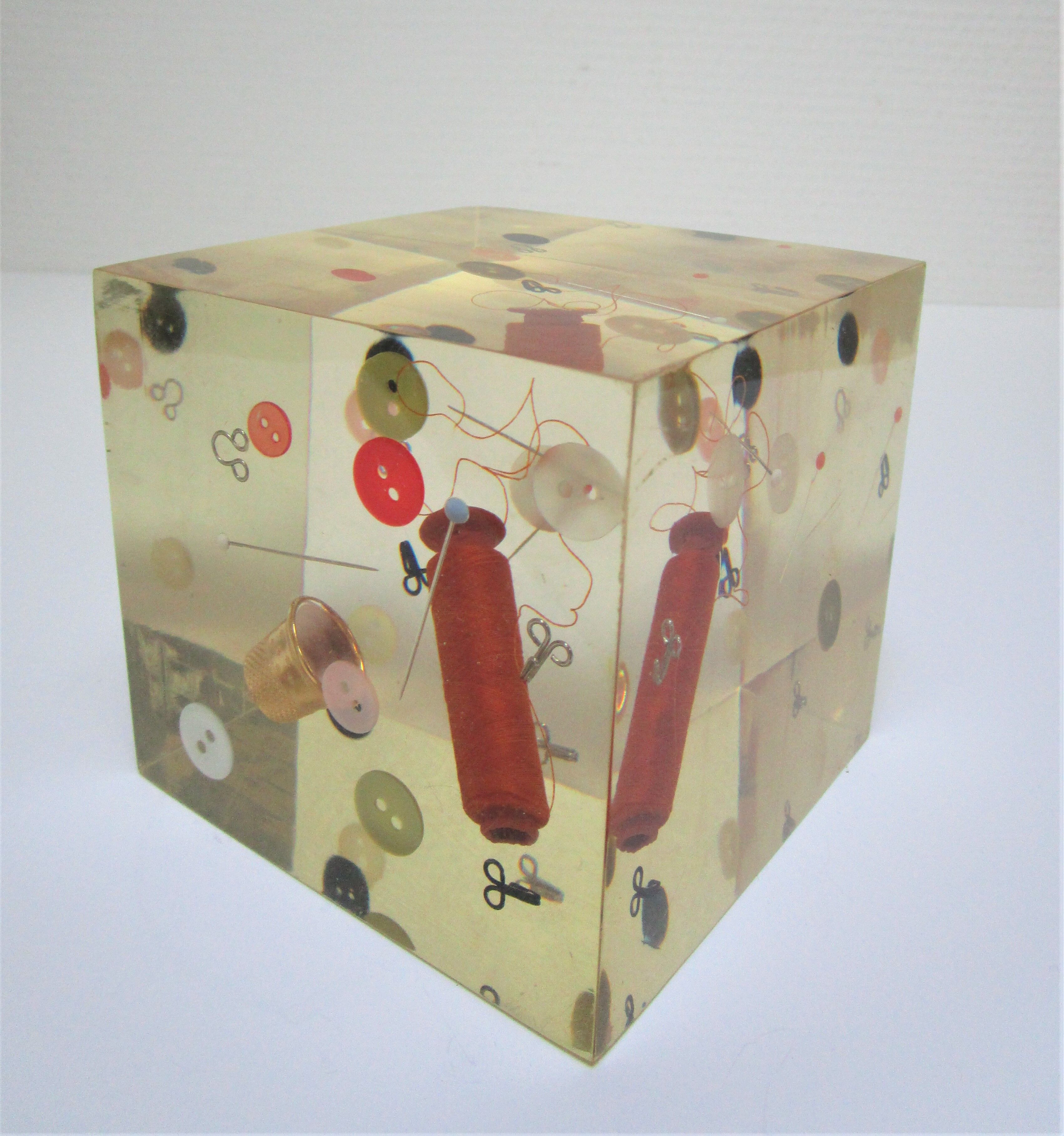 Paperweight sculpture block resin inclusions sewing design 70s