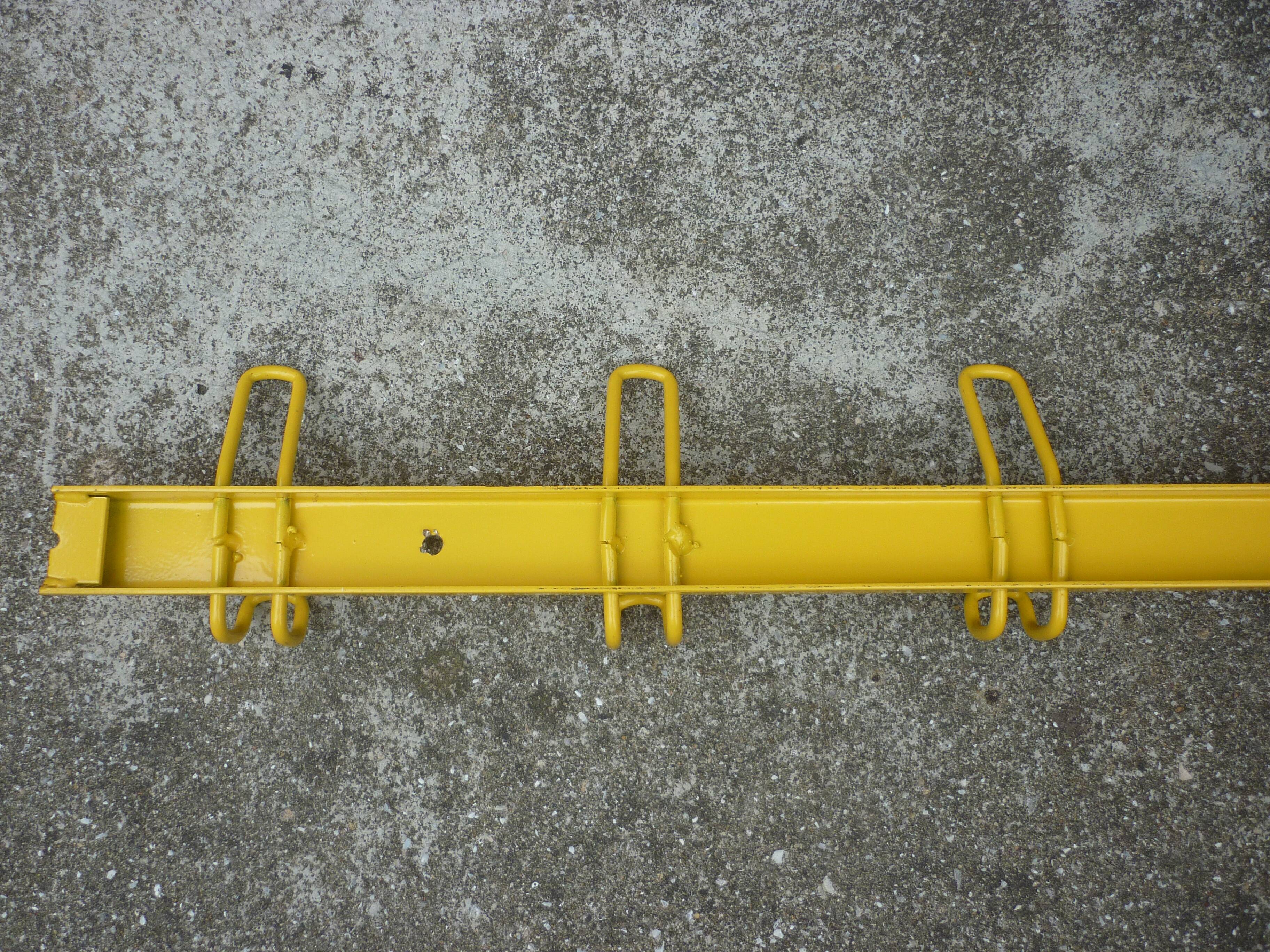 Yellow metal wall coat holder