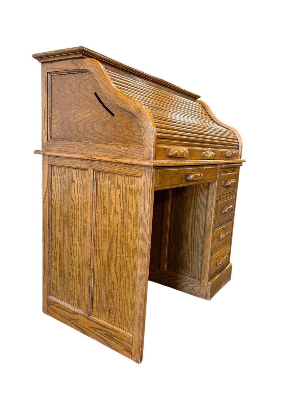 Vintage American wooden desk with a roll-top.