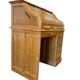 Vintage American wooden desk with a roll-top.