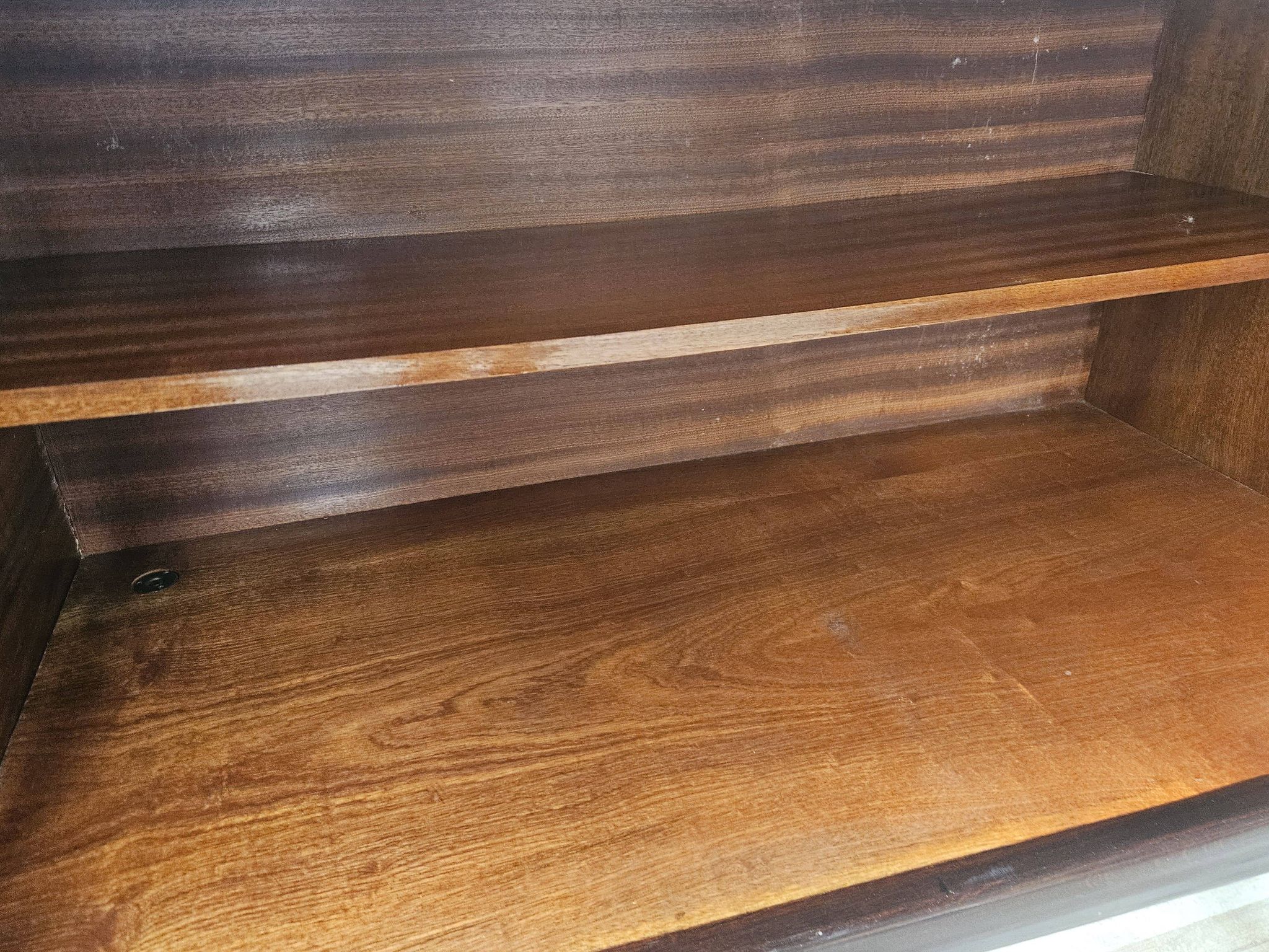 Mid-century mahogany buffet with teal glass and compartments with a drawer.