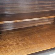 Mid-century mahogany buffet with teal glass and compartments with a drawer.