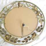 Round gilded metal mirror, crown of roses