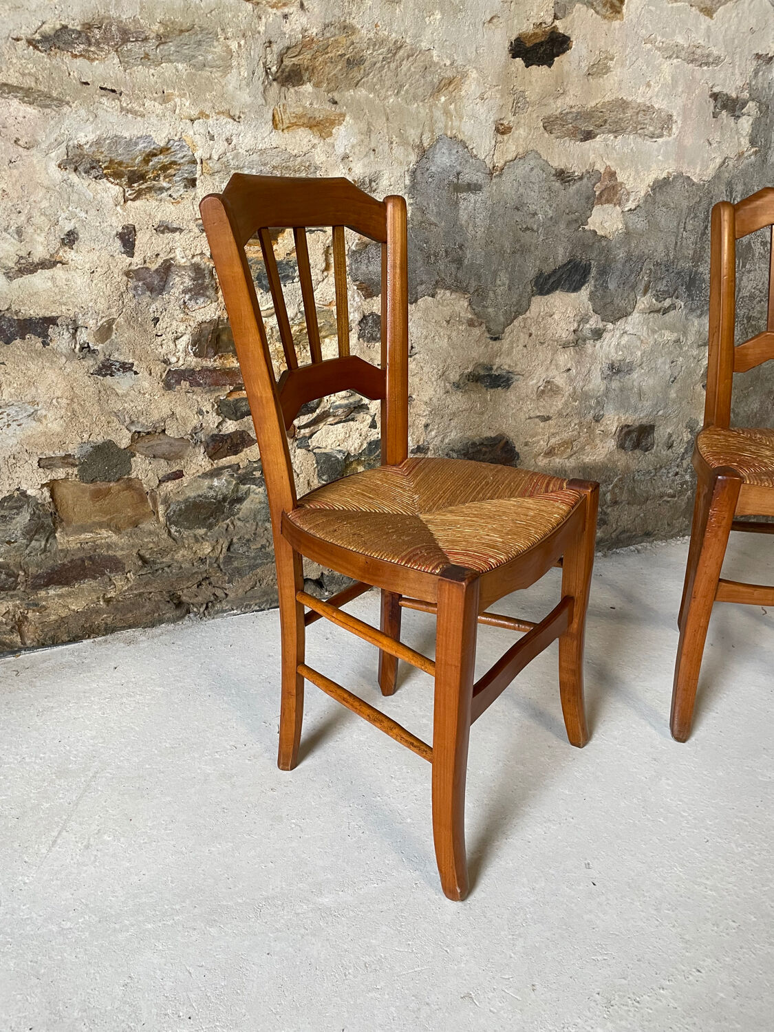 Set of 2 antique wooden and straw chairs.