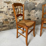 Set of 2 antique wooden and straw chairs.