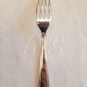 Silver cutlery set for 36 place settings and its ladle.