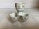 Three egg cups with geometric patterns in beige and brown.