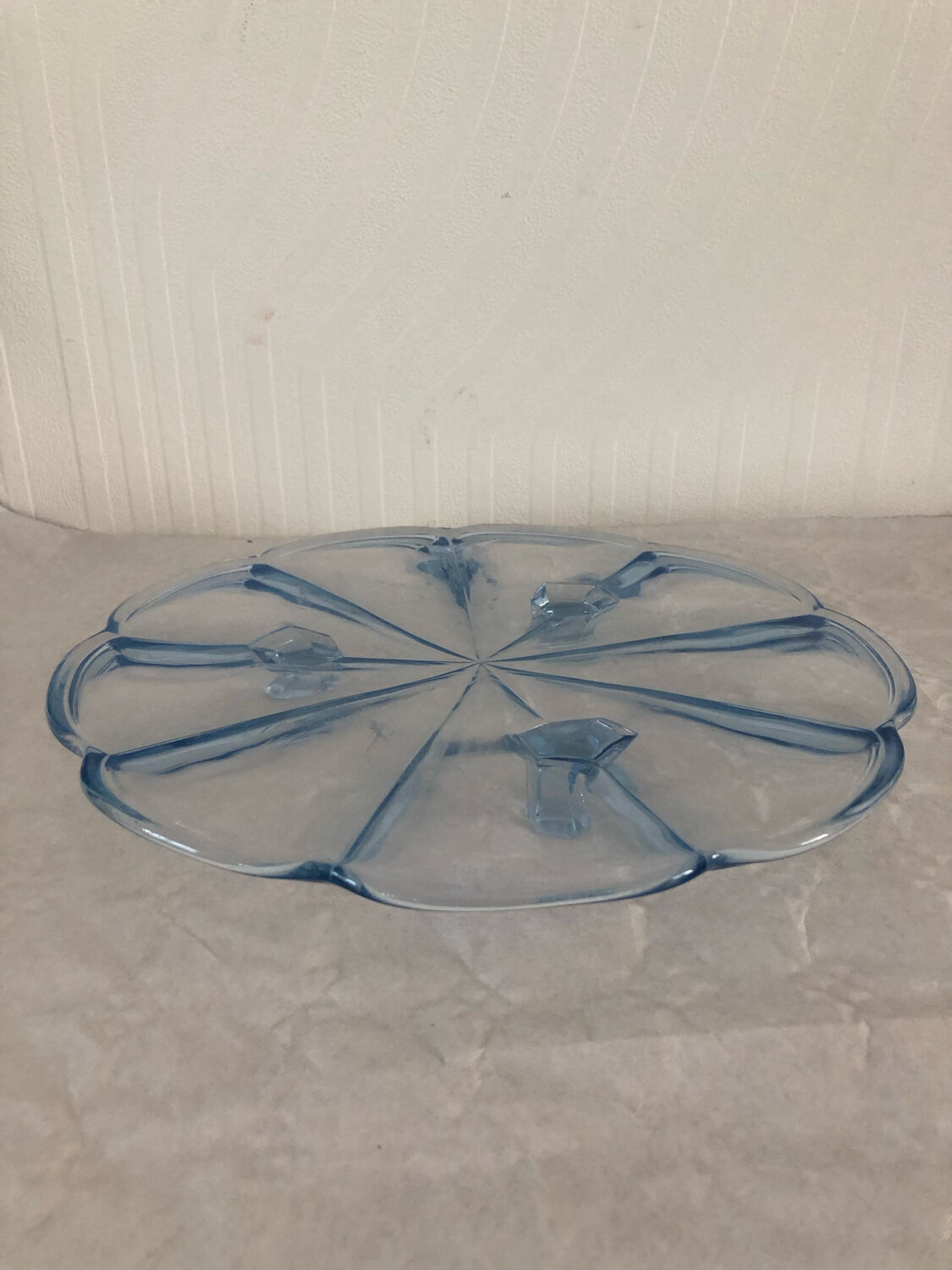 Blue transparent glass pie dish on vintage stand