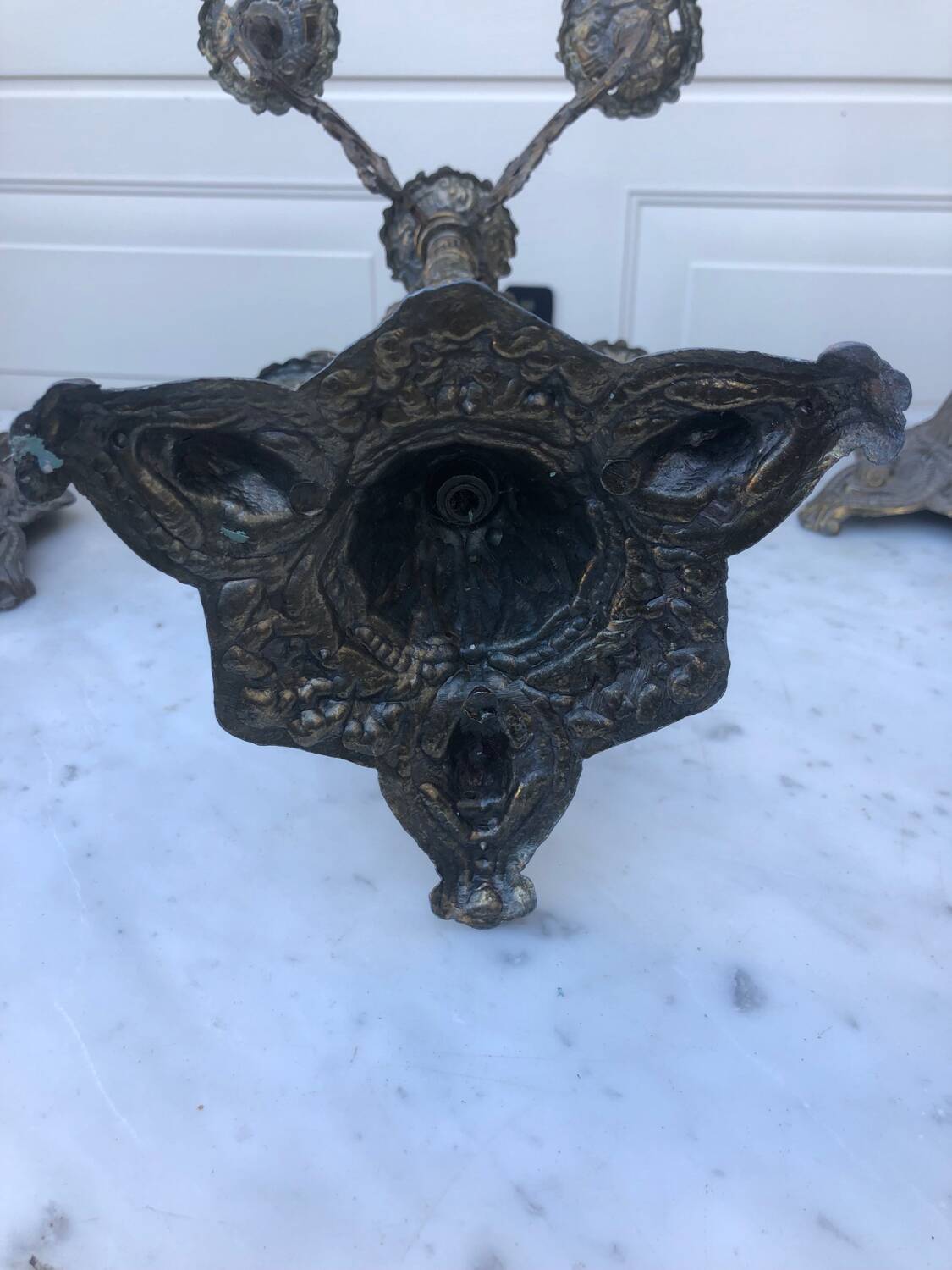 4 identical old brass candlesticks