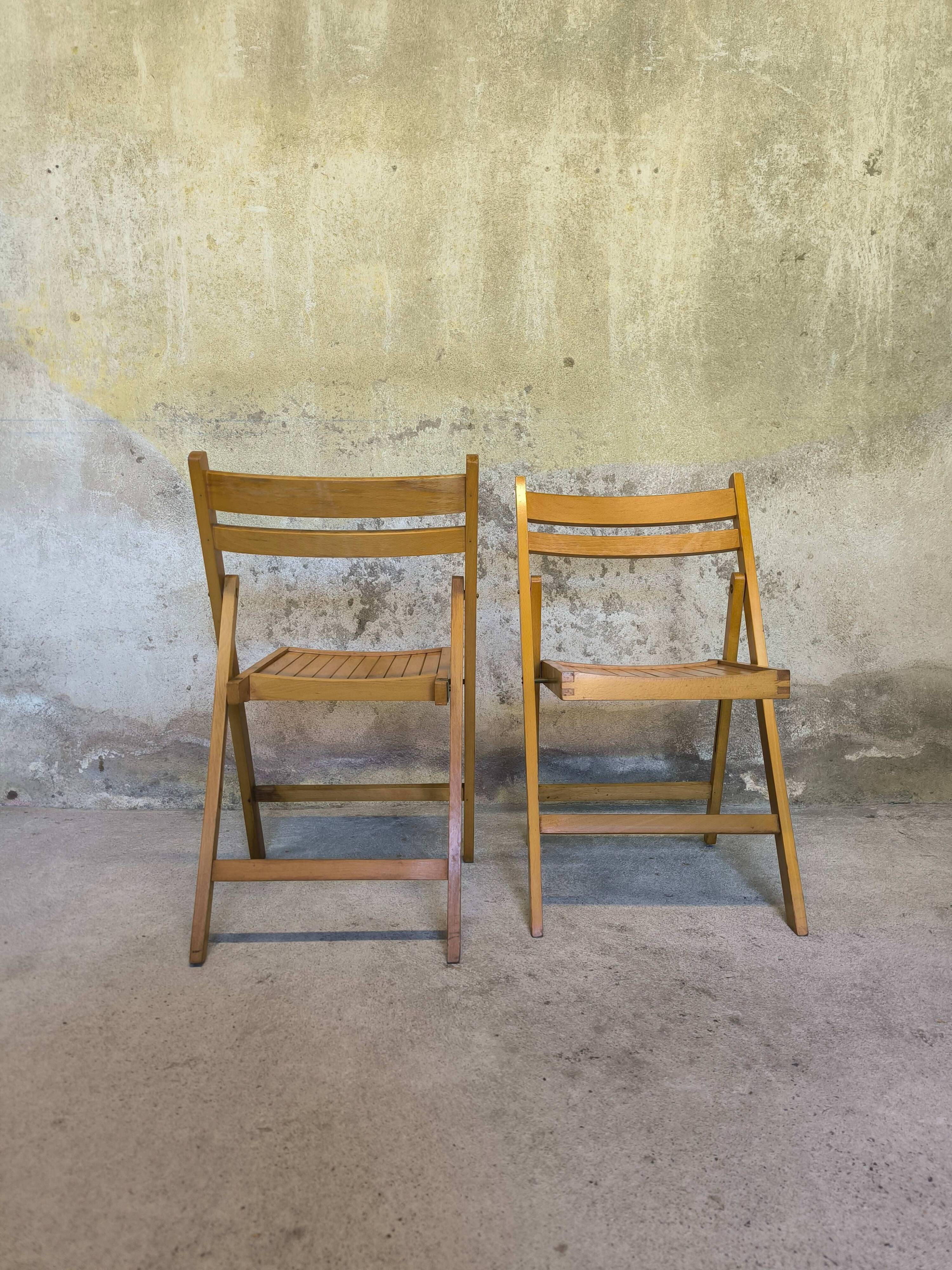 Pair of vintage folding wooden chairs
