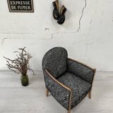 Club armchair in wood and fabric.