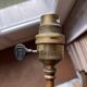 Rare articulated tripod base table lamp in gold-plated brass