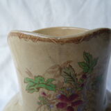 Antique pitcher decorated with flowers