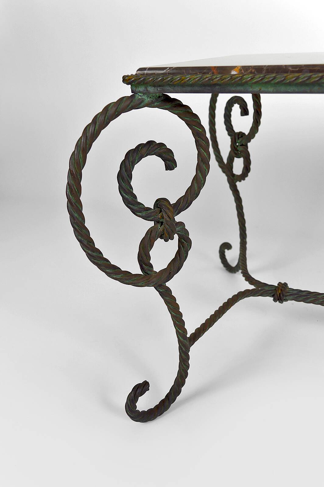 Coffee table in patinated wrought iron and black marble, circa 1940