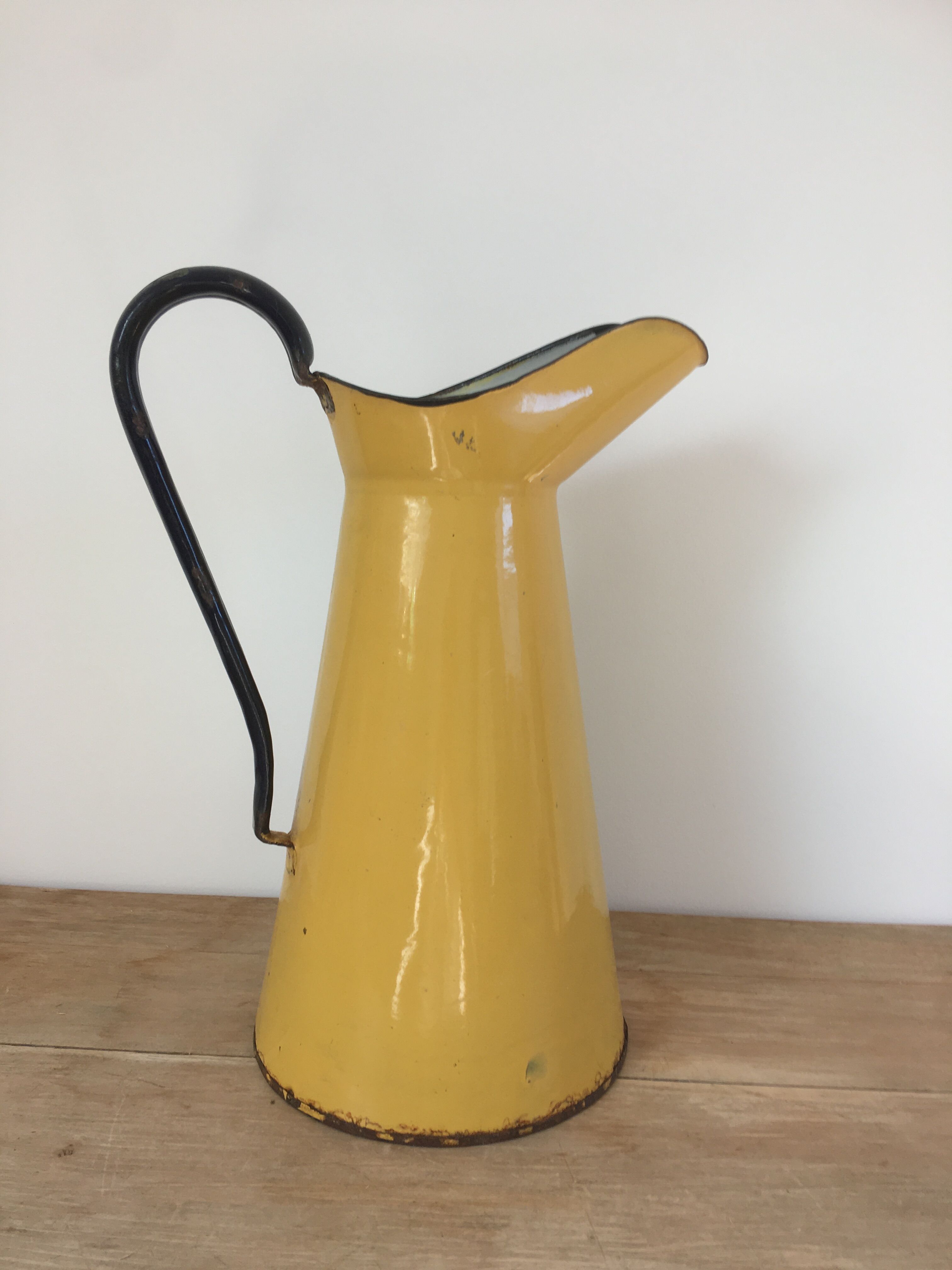 Mustard yellow enamelled sheet metal pitcher