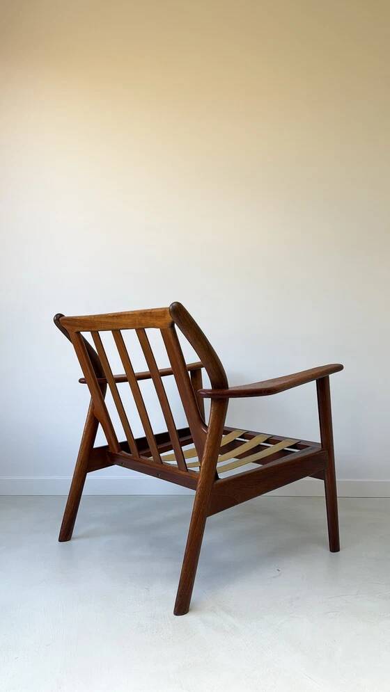 Vintage teak wooden armchair