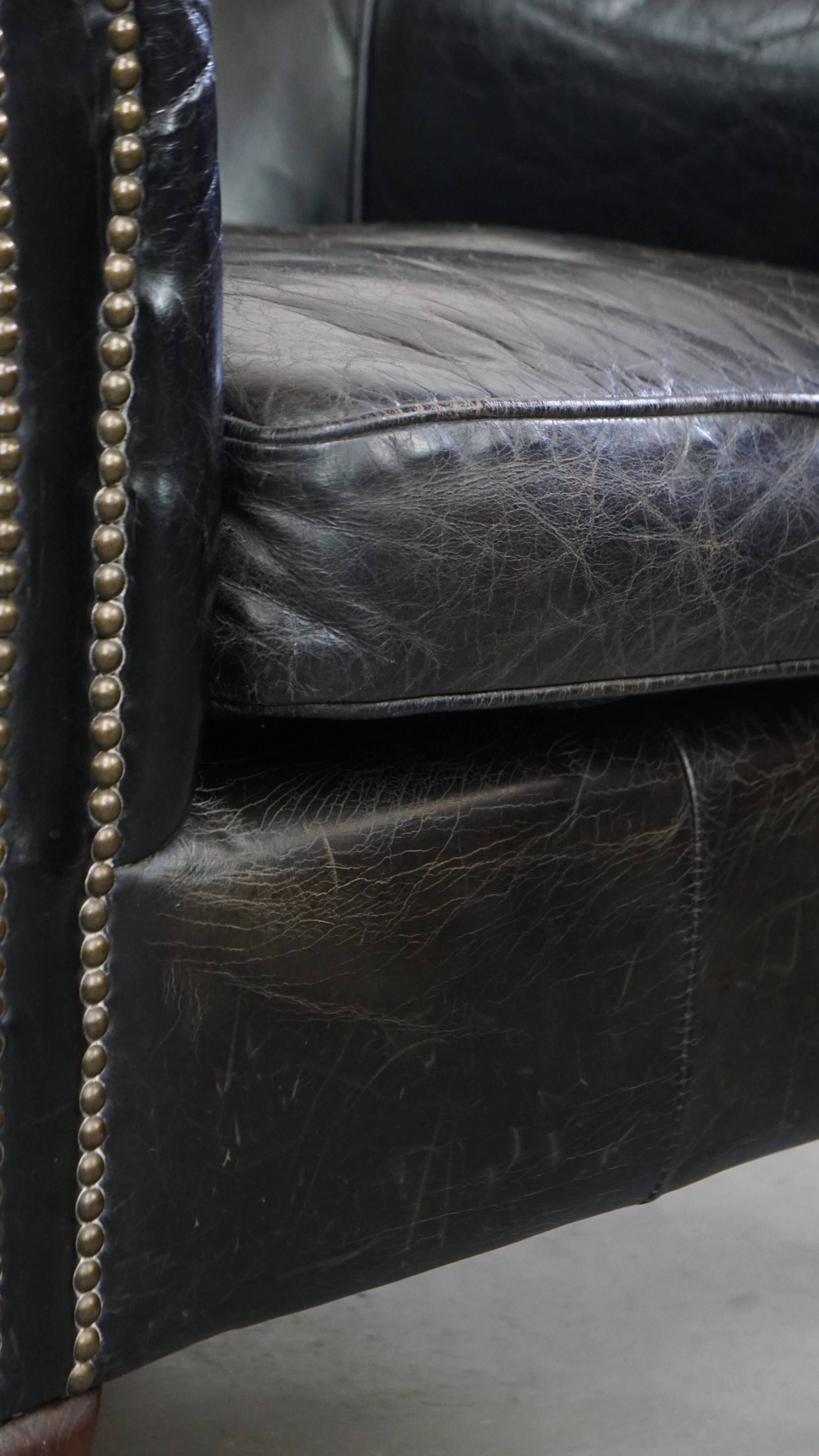 Black cowhide leather armchair