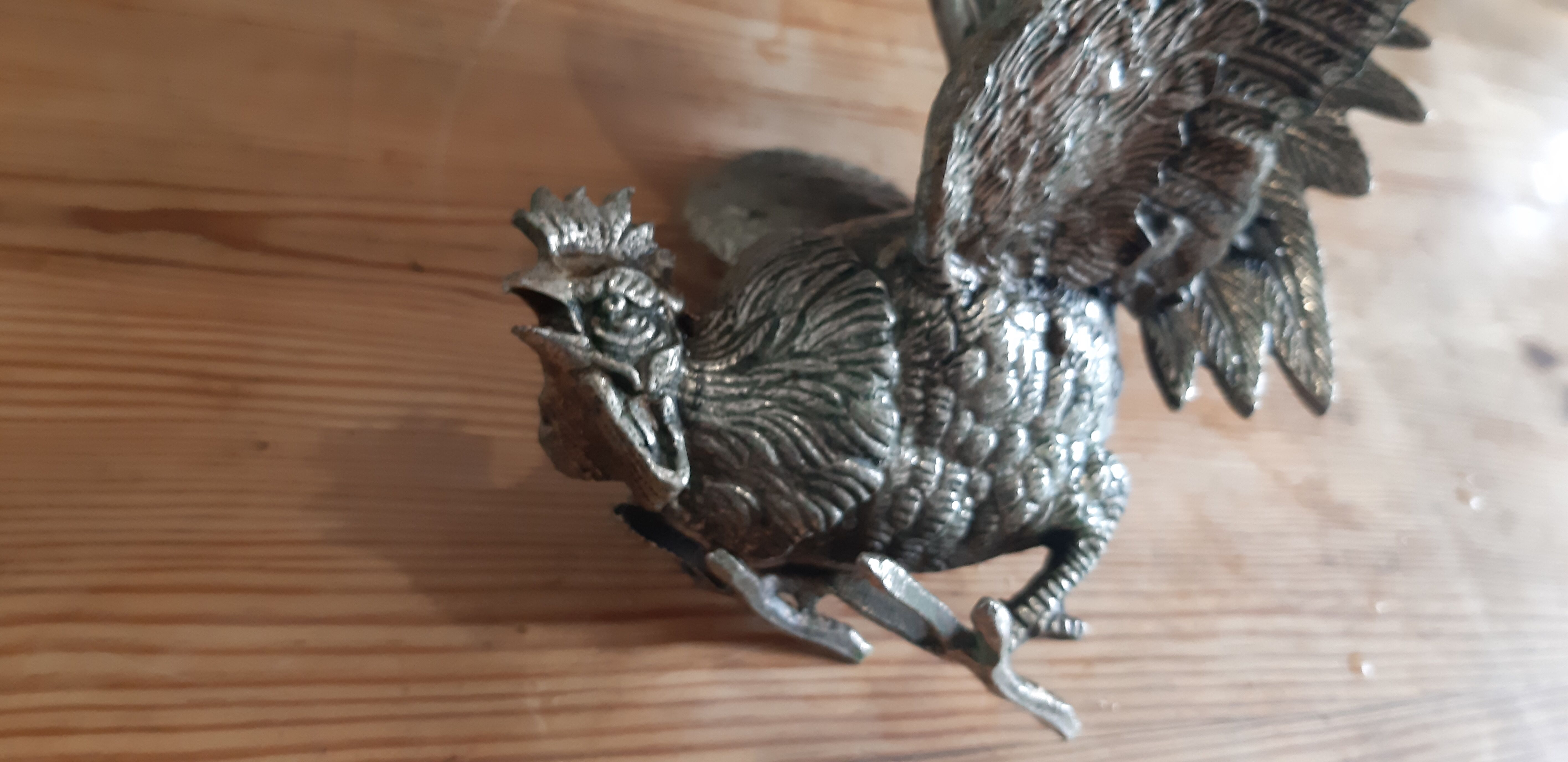 2 silver metal roosters