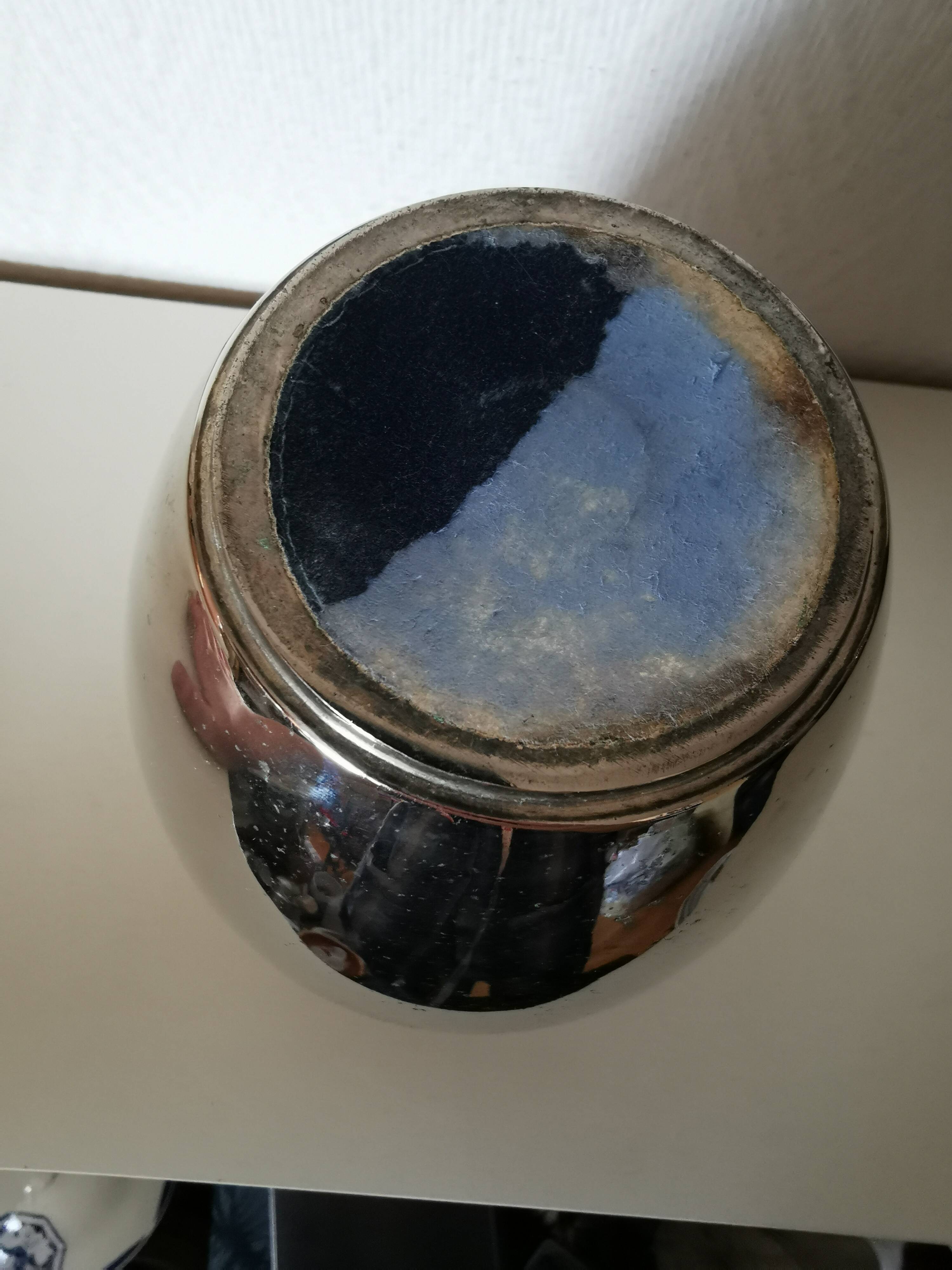 metal vase, flowers in relief