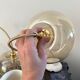 Set of three new electrified golden glass pendant lamps