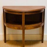 Old mahogany half-moon table with side shutters.
