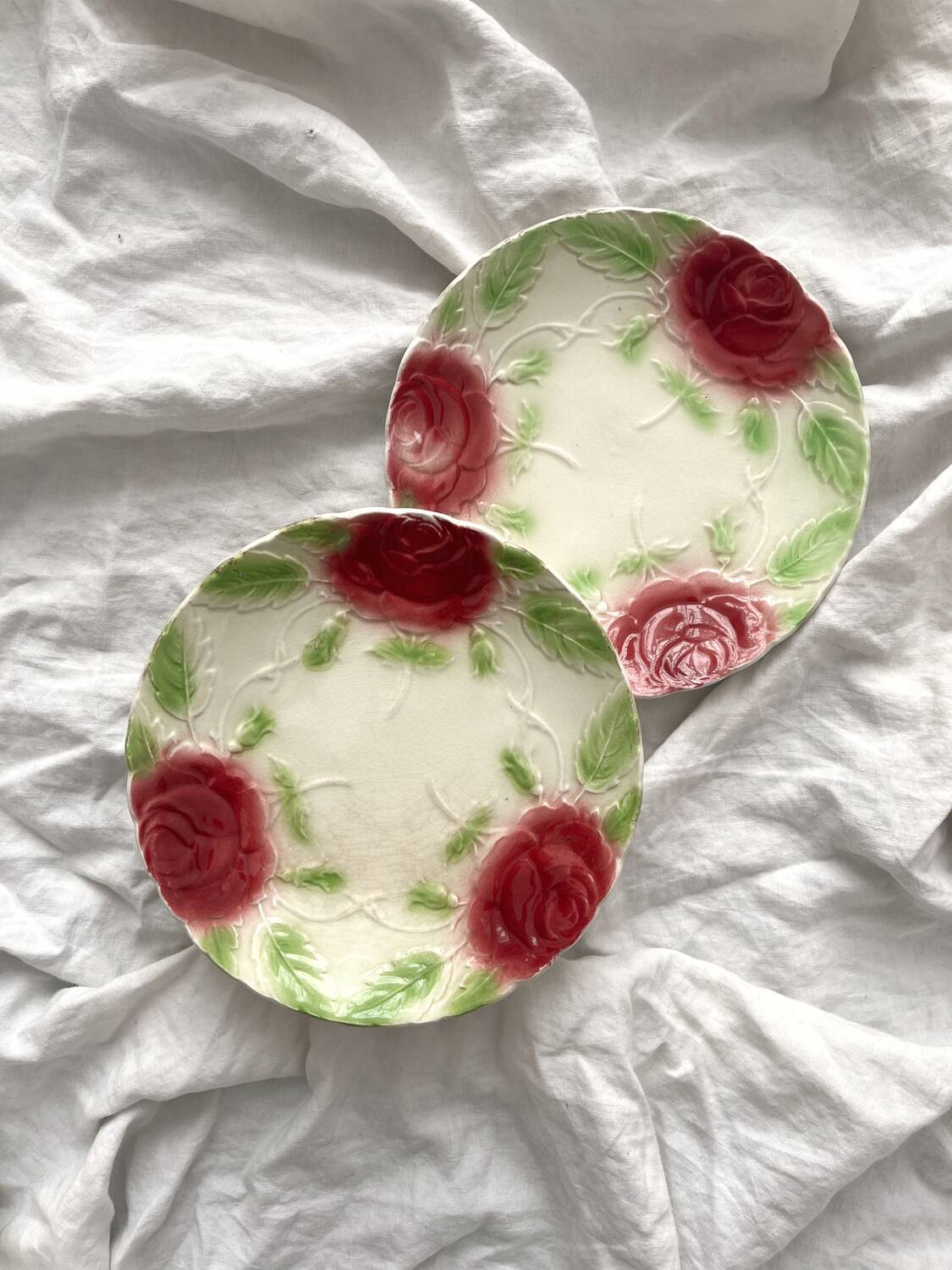2 old slip plates decorated with roses