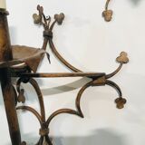 Pair of gilded metal sconces decorated with clovers.
