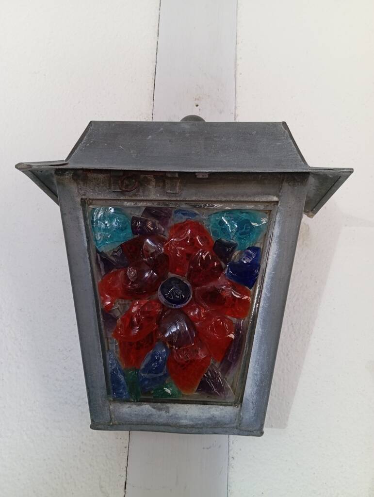 Zinc and colored glass wall light