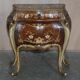 Pair of curved walnut commodes with marquetry and marble tops.