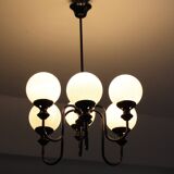 Metal chandelier and glass globes