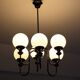 Metal chandelier and glass globes