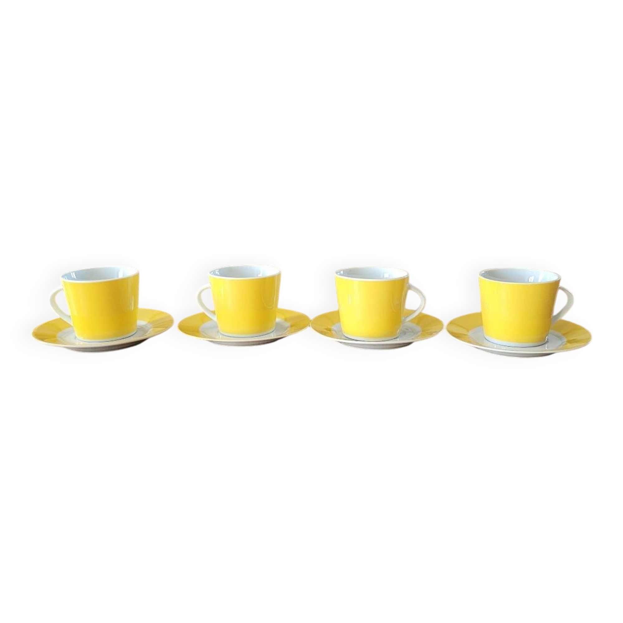 4 yellow and white cups and saucers