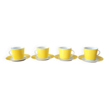 4 yellow and white cups and saucers