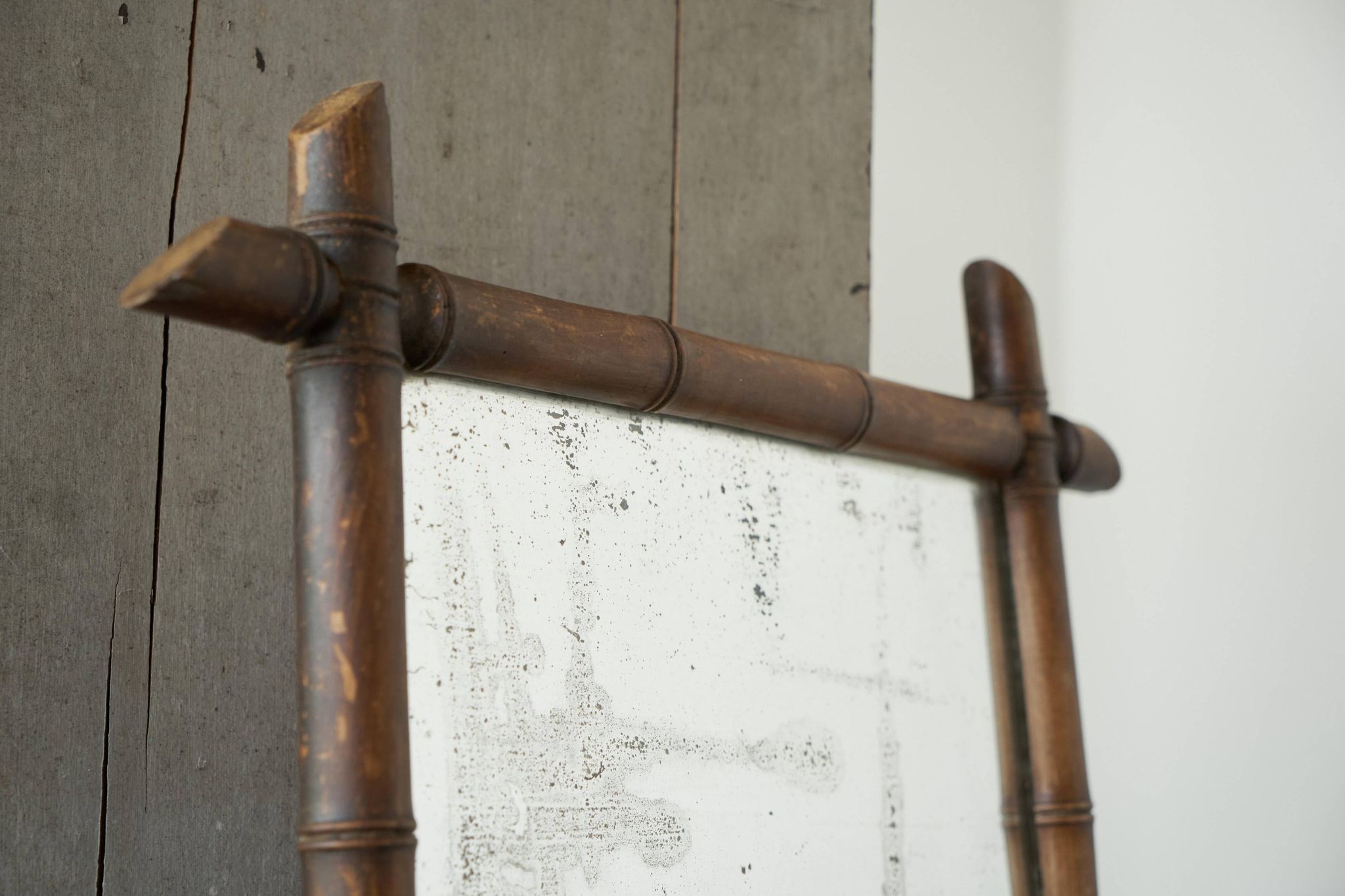 Large faux bamboo mirror in solid wood and patinated mirror, early 20th century.