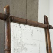 Large faux bamboo mirror in solid wood and patinated mirror, early 20th century.