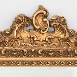 Miroir en bois et stuc doré à décor de rinceaux et coquilles de style Rocaille  74x54cm
