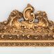 Wooden mirror and gilded stucco decorated with rockery style rinceaux and shells