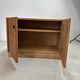 Low buffet with horizontal fronts and recessed handles in the spirit of the Regain house.