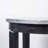 Round Art Deco black painted wooden side table with lower shelf, 1930s.