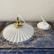 Suspension in electrified serrated white opaline to nine
