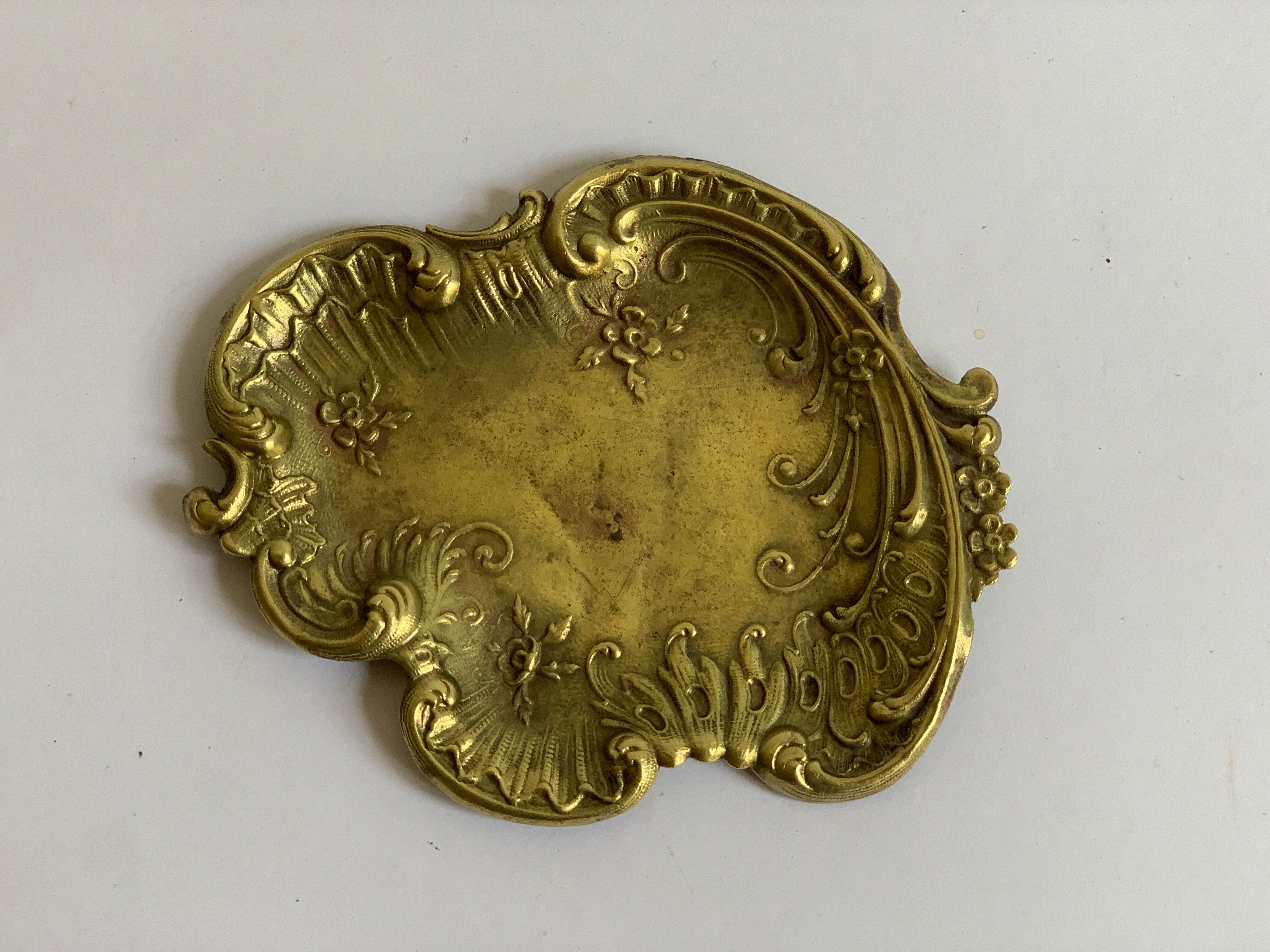 Empty art nouveau brass pocket