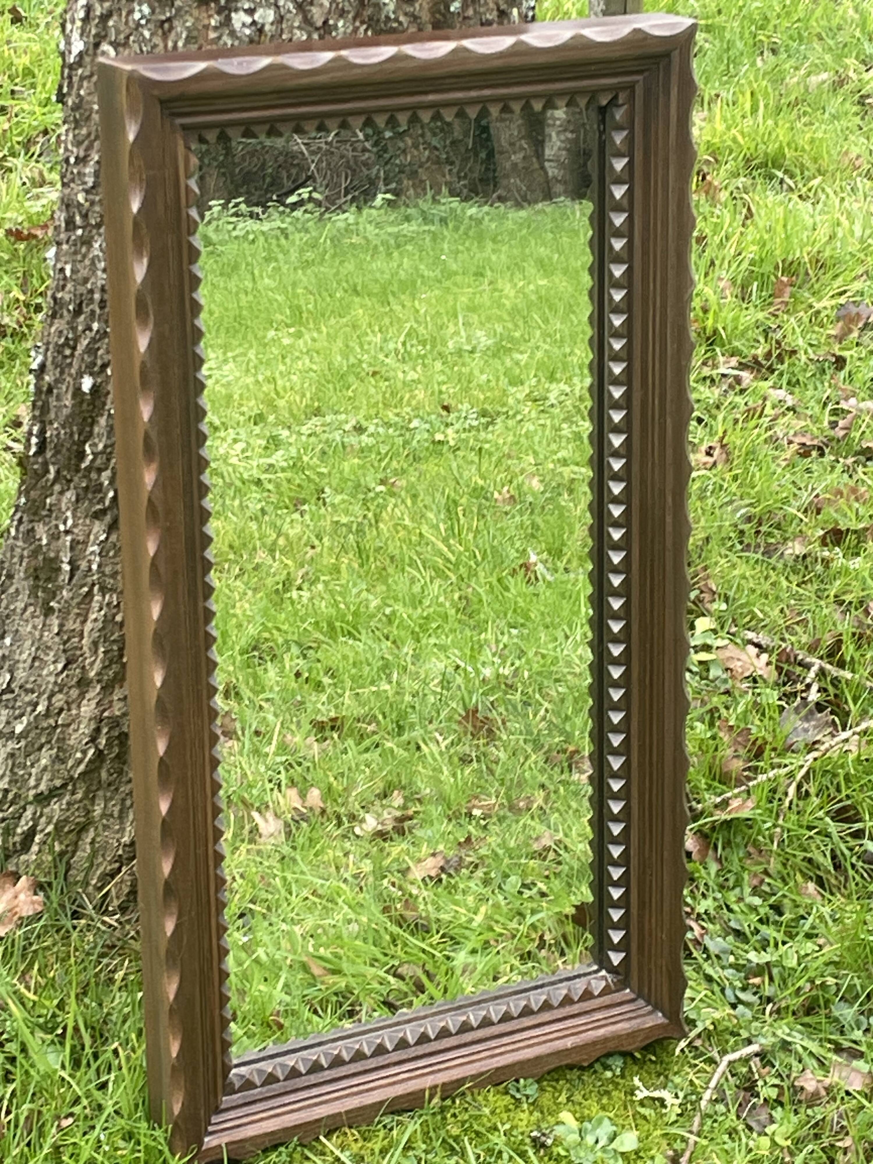 Rustic mirror called brutalist, molded carved natural wood