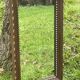 Rustic mirror called brutalist, molded carved natural wood