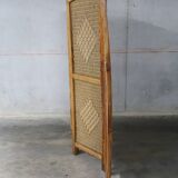 Handcrafted screen in exotic wood and rope.