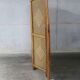 Handcrafted screen in exotic wood and rope.