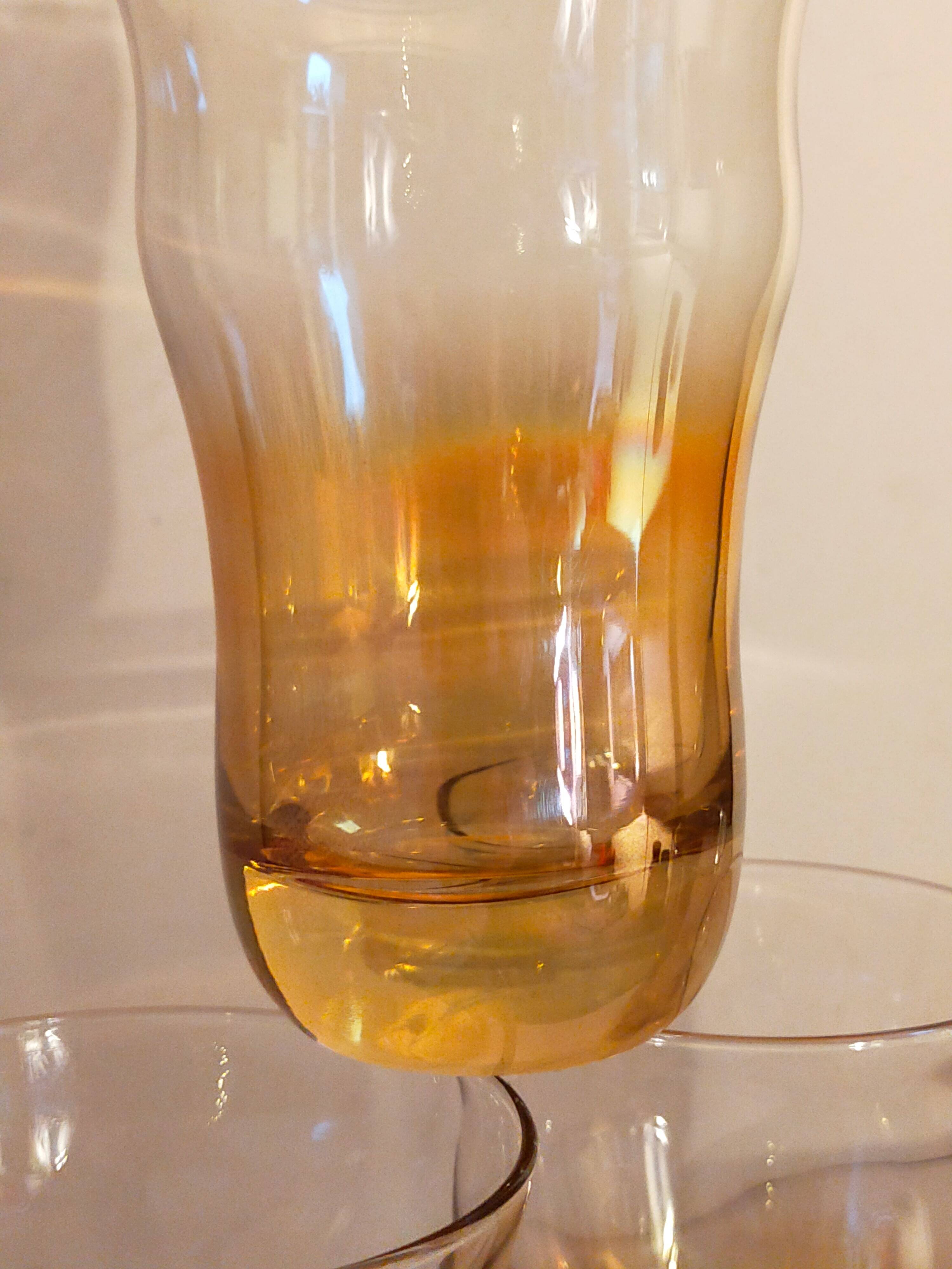 Four iridescent honey blown glass glasses