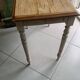 Antique wooden desk with a patinated base