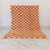 Orange checkered rug made entirely by hand