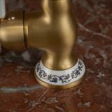 Small antique washbasin in wood and red marble.